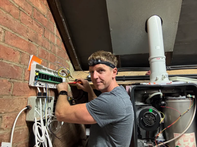 Paul Watson re-wirering a circuit board. Specialist in Heatmiser, installation and repair